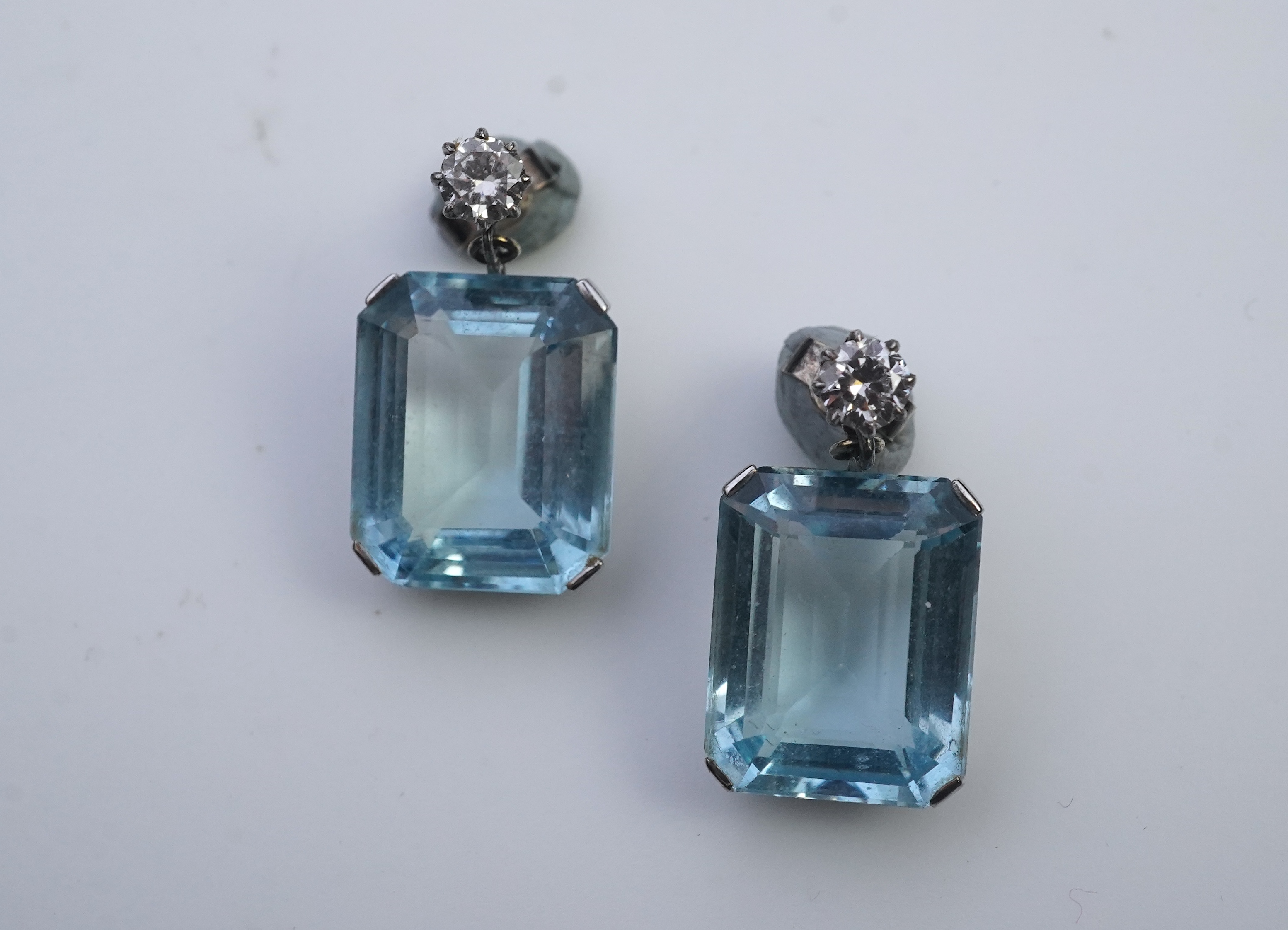 A pair of aquamarine and diamond earrings